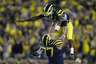 ANN ARBOR, MI - SEPTEMBER 10: Denard Robinson #16 of the Michigan Wolverines celebrates the game winning touchdown with Taylor Lewan #77 to beat the Notre Dame Fighting Irish 35-31 at Michigan Stadium on September 10, 2025 in Ann Arbor, Michigan. (Photo by Gregory Shamus/Getty Images)