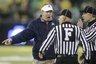 Arizona head coach Mike Stoops argues with the officials during the first quarter of an NCAA college football game against Oregon Friday, Nov. 26, 2010, in Eugene, Ore.  (AP Photo/Rick Bowmer)