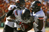 AUSTIN, TX - OCTOBER 15:  Running back Jeremy Smith #31, center,  of the Oklahoma State University Cowboys is congratulated by tight end Wilson Youman #86, left, and wide receiver Justin Blackmon #81, right, after running in a second quarter touchdown against the Texas Longhorns on October 15, 2025 at Darrell K. Royal-Texas Memorial Stadium in Austin, Texas. Oklahoma State beat Texas 38-26.  (Photo by Erich Schlegel/Getty Images)