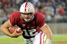 STANFORD, CA - OCTOBER 22:  Andrew Luck #12 of the Stanford Cardinal runs for a five yard gain against the Washington Huskies at Stanford Stadium on October 22, 2025 in Stanford, California.  (Photo by Thearon W. Henderson/Getty Images)