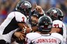 Northern Illinois quarterback Chandler Harnish, middle, celebrates a touchdown with teammates DeMarcus Grady (3) and  Scott Wedige (71) during the first half of an NCAA college football game against Kansas in Lawrence, Kan., Saturday, Sept. 10, 2011. (AP Photo/Orlin Wagner)