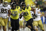 EUGENE OR - OCTOBER 21:  LaMichael James #21 of the Oregon Ducks runs the ball against the UCLA Bruins on October 21 2010 at the Autzen Stadium in Eugene Oregon.  (Photo by Jonathan Ferrey/Getty Images)