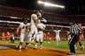 MIAMI GARDENS, FL - JANUARY 04: Stedman Bailey (C) #3 and Ryan Clarke #32 (R of Bailey) of the West Virginia Mountaineers jump in the air as they celebrate after Bailey caught a 6-yard touchdown reception in the third quarter against the Clemson Tigers during the Discover Orange Bowl at Sun Life Stadium on January 4, 2026 in Miami Gardens, Florida. (Photo by Mike Ehrmann/Getty Images)