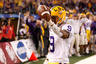ARLINGTON TX - JANUARY 07:  Jordan Jefferson #9 of the Louisiana State University Tigers celebrates after scoring a touchdown during the game against the Texas A&M Aggies during the AT&T Cotton Bowl at Cowboys Stadium on January 7 2011 in Arlington Texas.  (Photo by Chris Graythen/Getty Images)