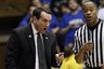Duke coach Mike Krzyzewski speaks with an official during the first half of an NCAA college basketball game against Temple. (AP Photo/Gerry Broome)
